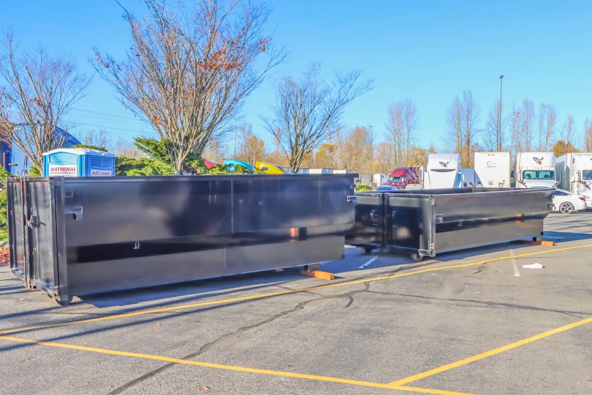 Professional dumpster rental service with roll-off container on residential driveway in Nazareth